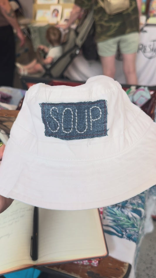 white SOUP bucket hat